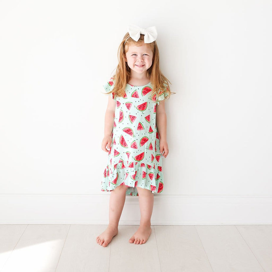 Toddler wearing Mellony Ruffled Cap Sleeve Hi-Low Dress in watermelon print